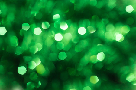 Defocused abstract green background. Blurred holiday bokeh.の写真素材