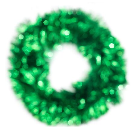 Green Christmas lights wreath bokeh - A bright bokeh background created by Christmas lights.の写真素材