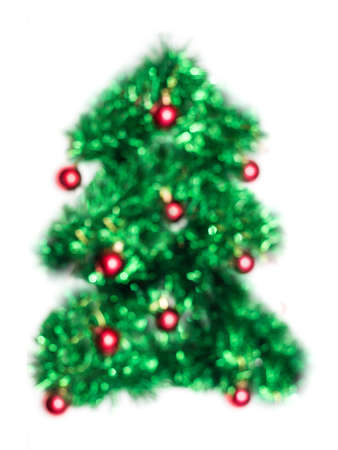 Green Christmas lights fir tree bokeh - A bright bokeh background created by Christmas lights.の写真素材