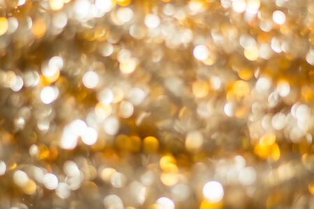 gold abstract background with bokeh defocused lights.の写真素材