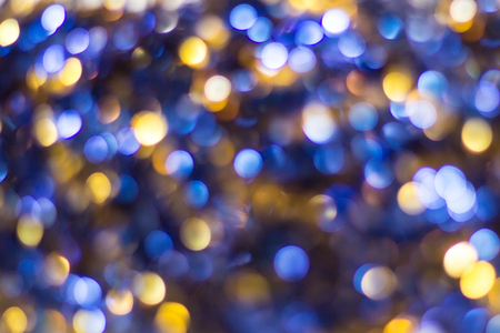 Blue Yellow White bokeh. Christmas background texture.の写真素材