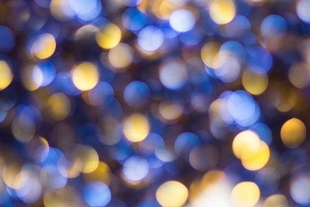 Blue Yellow White bokeh. Christmas background texture.の写真素材