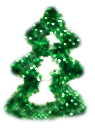 Green Christmas lights fir tree bokeh - A bright bokeh background created by Christmas lights.の写真素材