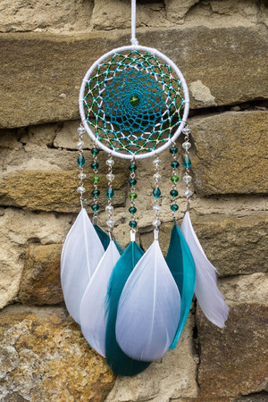 Dream catcher with feathers threads and beads rope hanging. Dreamcatcher handmadeの写真素材