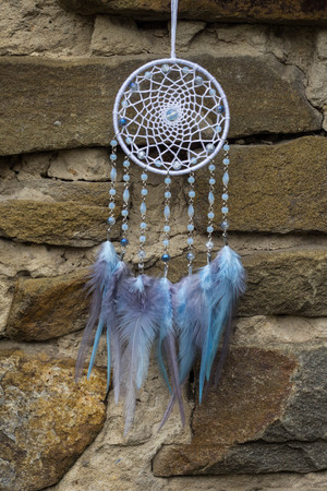 Dream catcher with feathers threads and beads rope hanging. Dreamcatcher handmadeの写真素材