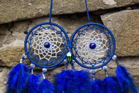 Dream catcher with feathers threads and beads rope hanging. Dreamcatcher handmadeの写真素材