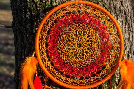 Dream catcher with feathers threads and beads rope hanging. Dreamcatcher handmadeの写真素材