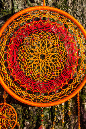 Dream catcher with feathers threads and beads rope hanging. Dreamcatcher handmadeの写真素材