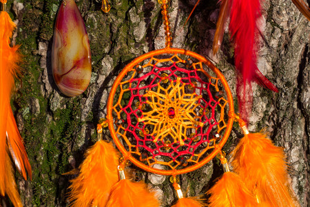 Dream catcher with feathers threads and beads rope hanging. Dreamcatcher handmadeの写真素材