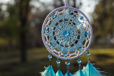 Dream catcher with feathers threads and beads rope hanging. Dreamcatcher handmadeの写真素材