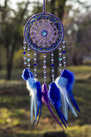 Dream catcher with feathers threads and beads rope hanging. Dreamcatcher handmadeの写真素材