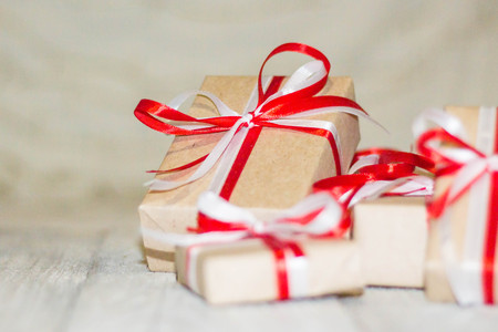 Christmas gift box against bokeh background. Holiday greeting card.の写真素材