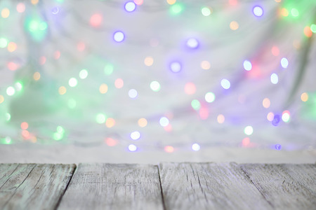 Empty wooden table or shelf wall on colorful bokeh background. For present your products.の写真素材