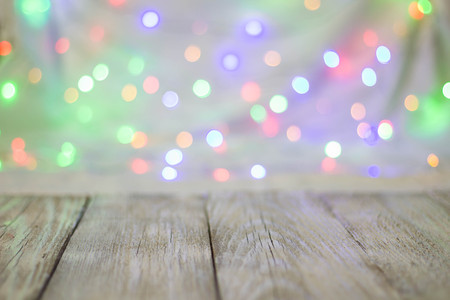 Empty wooden table or shelf wall on colorful bokeh background. For present your products.