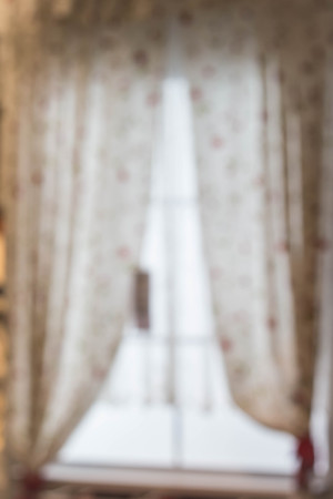 Abstract and blurry image of window with curtains.の写真素材