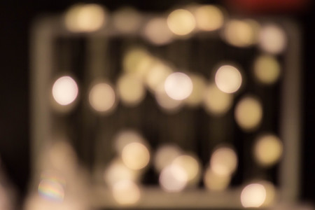 Blurred garland. City night light blur bokeh, defocused background. Christmas abstract pattern.の写真素材