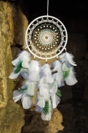 Dream catcher with feathers threads and beads rope hanging. Dreamcatcher handmadeの写真素材