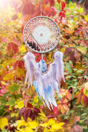 Dream catcher with feathers threads and beads rope hanging. Dreamcatcher handmadeの写真素材