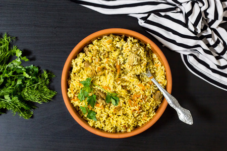 Pilaf with beef, carrots, onions, garlic, pepper and cumin. A traditional dish of Asian cuisine. Selective focusの写真素材