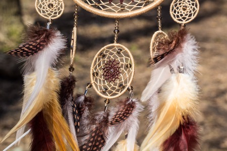 Dream catcher with feathers threads and beads rope hanging. Dreamcatcher handmadeの写真素材