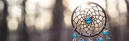 Banner of Dreamcatcher with bat made of feathers leather beads and ropes, hangingの写真素材