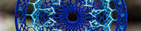 Banner of Dreamcatcher made of feathers leather beads and ropes, hanging