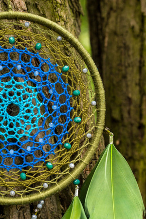 Dream catcher with feathers threads and beads rope hanging. Dreamcatcher handmadeの写真素材
