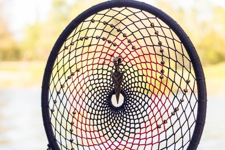 Dream catcher with feathers threads and beads rope hanging. Dreamcatcher handmadeの写真素材