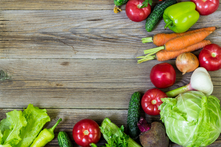 Top view of healthy food background with copy space. Healthy food concept with fresh vegetables and ingredients for cooking.の写真素材