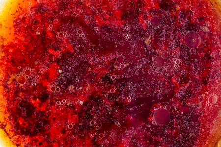Stains of fat on the surface of water abstraction. Creative rough textured background.の写真素材