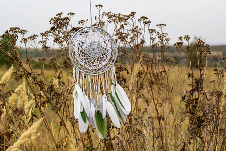 Dream catcher with feathers threads and beads rope hanging. Dreamcatcher handmadeの写真素材