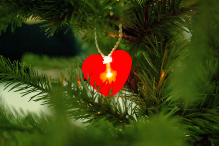 Christmas tree with toys and decorative snow for a happy new year.の写真素材