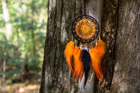 Dream catcher with feathers threads and beads rope hanging. Dreamcatcher handmadeの写真素材