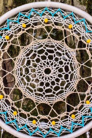 Dream catcher with feathers threads and beads rope hanging. Dreamcatcher handmade