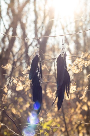 earrings of Dream catcher with feathers threads and beads rope hanging. Dreamcatcher handmadeの写真素材