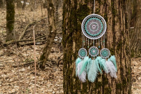 Dream catcher with feathers threads and beads rope hanging. Dreamcatcher handmade