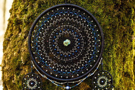 Dream catcher with feathers threads and beads rope hanging. Dreamcatcher handmadeの写真素材