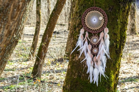 Dream catcher with feathers threads and beads rope hanging. Dreamcatcher handmadeの写真素材