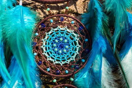 Dream catcher with feathers threads and beads rope hanging. Dreamcatcher handmadeの写真素材