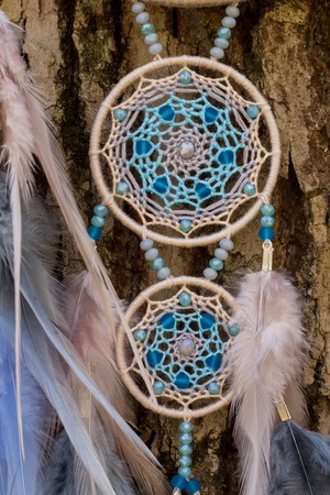 Dream catcher with feathers threads and beads rope hanging. Dreamcatcher handmadeの写真素材