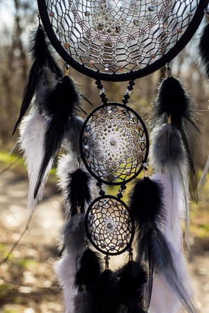 Dream catcher with feathers threads and beads rope hanging. Dreamcatcher handmadeの写真素材