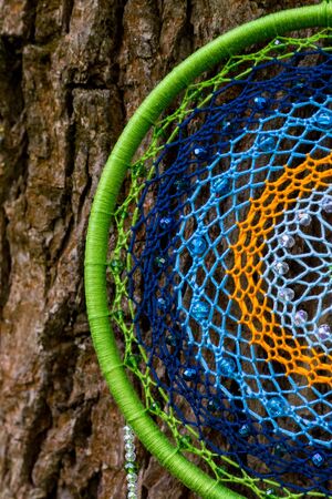 Dream catcher with feathers threads and beads rope hanging. Dreamcatcher handmadeの写真素材