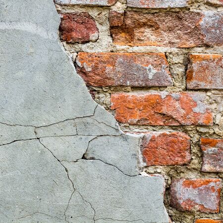 Background of old vintage brick wall with concrete,Weathered texture of racked concrete vintage...