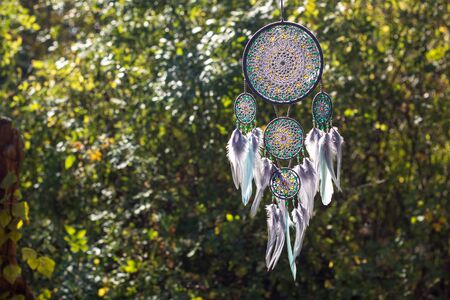 Dream catcher with feathers threads and beads rope hanging. Dreamcatcher handmadeの写真素材