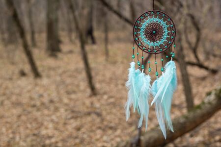 Dream catcher with feathers threads and beads rope hanging. Dreamcatcher handmade