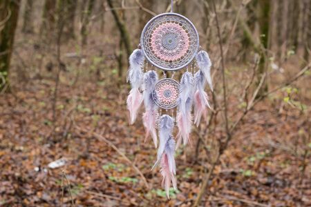 Dream catcher with feathers threads and beads rope hanging. Dreamcatcher handmadeの写真素材