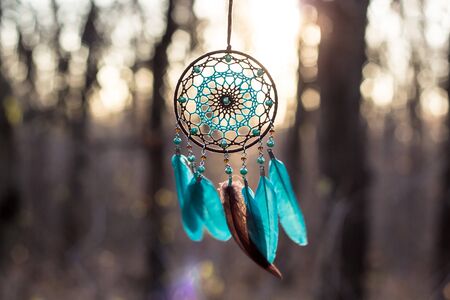 Dream catcher with feathers threads and beads rope hanging. Dreamcatcher handmadeの写真素材