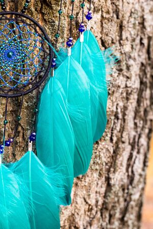 Dream catcher with feathers threads and beads rope hanging. Dreamcatcher handmadeの写真素材