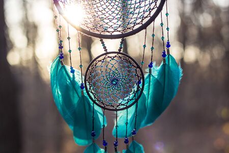 Dream catcher with feathers threads and beads rope hanging. Dreamcatcher handmadeの写真素材