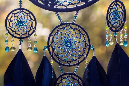 Dream catcher with feathers threads and beads rope hanging. Dreamcatcher handmadeの写真素材